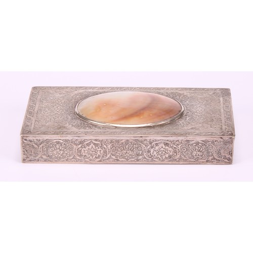 556 - A Persian silver coloured metal rectangular box, hinged cover set with a mother of pearl cabochon, c... 