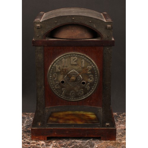 1551 - A Jugendstil oak mantel clock, 14cm dial embossed in the Arts and Crafts taste with Arabic numerals,... 