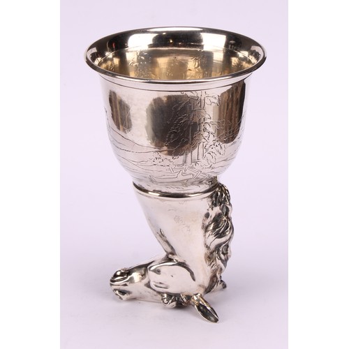 675 - A German silver novelty stirrup cup, as a horse's head, the ogee bowl engraved with a hunting scene,... 