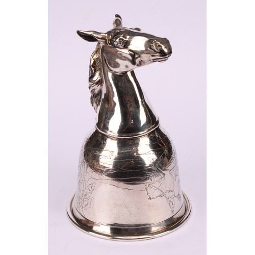 675 - A German silver novelty stirrup cup, as a horse's head, the ogee bowl engraved with a hunting scene,... 