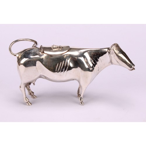 610 - A Dutch silver cow creamer, hinged cover, 13cm long, c.1900, 88g