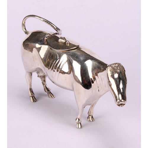 610 - A Dutch silver cow creamer, hinged cover, 13cm long, c.1900, 88g