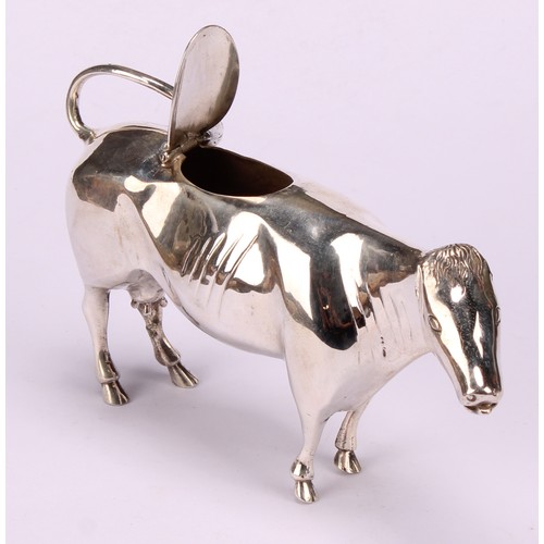 610 - A Dutch silver cow creamer, hinged cover, 13cm long, c.1900, 88g