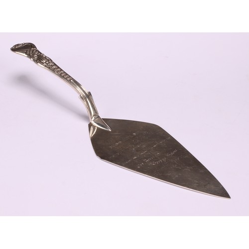 533 - A George IV silver Coburg pattern trowel shaped fish slice, the Hulme at Laying the First Stone of a... 