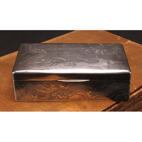 601 - A Chinese silver rectangular cigar box, engraved with dragons on a textured ground, hinged cover, ce... 