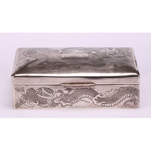 601 - A Chinese silver rectangular cigar box, engraved with dragons on a textured ground, hinged cover, ce... 