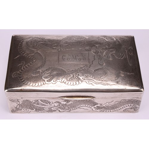 601 - A Chinese silver rectangular cigar box, engraved with dragons on a textured ground, hinged cover, ce... 