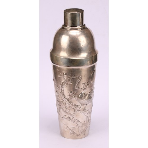 600 - A Chinese silver cocktail shaker, chased with blossoming prunus on a textured ground, 24cm high, cha... 