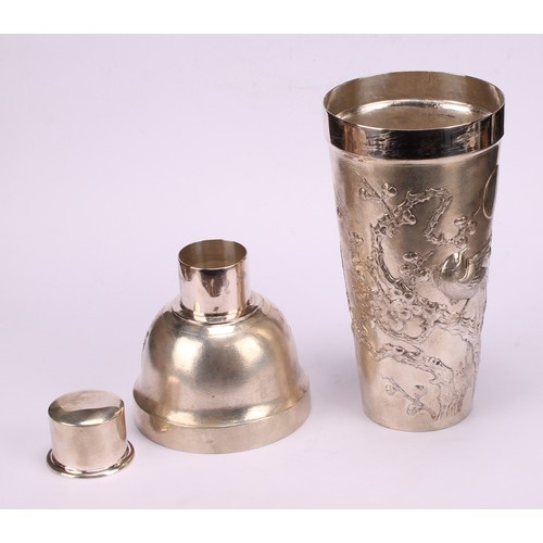 600 - A Chinese silver cocktail shaker, chased with blossoming prunus on a textured ground, 24cm high, cha... 