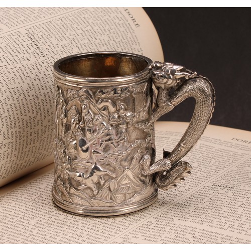 598 - A Chinese export silver mug, double-walled and profusely chased with figures of the court in a lands... 