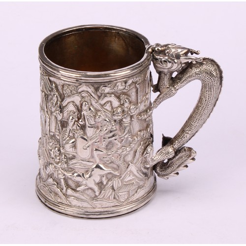 598 - A Chinese export silver mug, double-walled and profusely chased with figures of the court in a lands... 