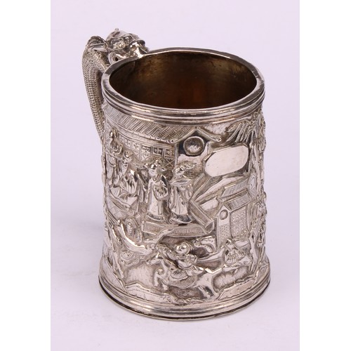 598 - A Chinese export silver mug, double-walled and profusely chased with figures of the court in a lands... 