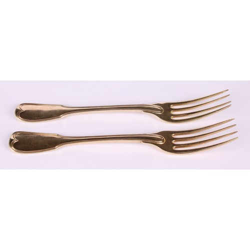 536 - A pair of early 19th century French silver-gilt Fiddle and Thread pattern table forks, 18cm long, Pa... 