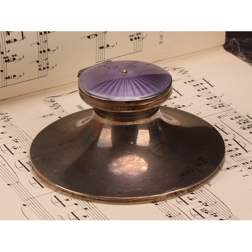 616 - A Edwardian silver and guilloche enamel capstan inkwell, hinged cover decorated in tones of purple, ... 