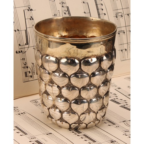 676 - A German silver snakeskin or pineapple beaker, gilt interior, 9.5cm high, 19th century, 220g