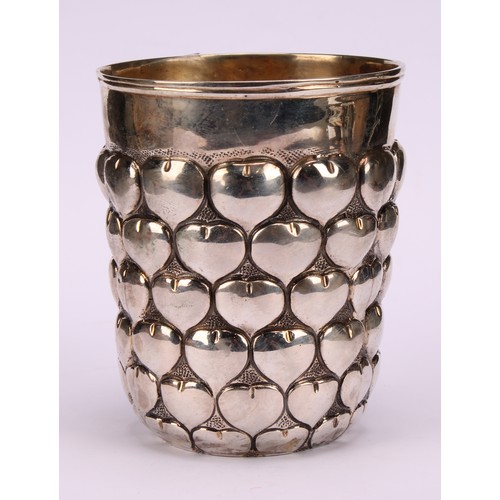 676 - A German silver snakeskin or pineapple beaker, gilt interior, 9.5cm high, 19th century, 220g