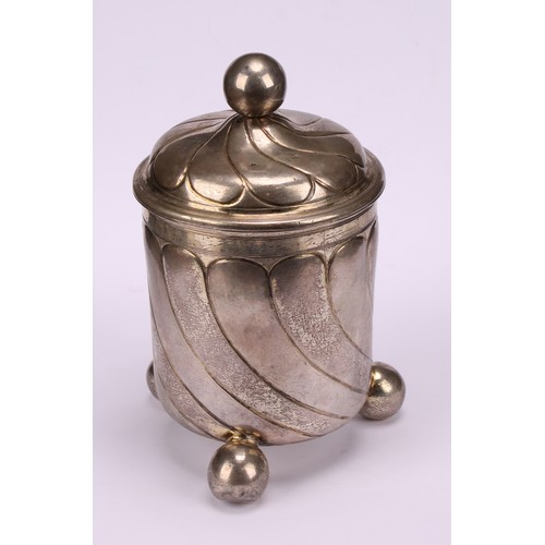 682 - A large 17th century German silver beaker and cover, wrythen fluted, ball finial and feet, gilt inte... 