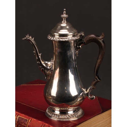 630 - A George III silver baluster coffee pot, hinged domed cover with fluted spire finial, scroll-capped ... 