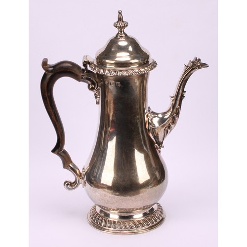 630 - A George III silver baluster coffee pot, hinged domed cover with fluted spire finial, scroll-capped ... 