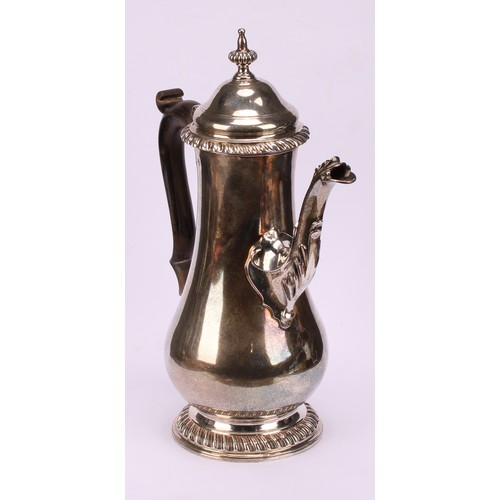 630 - A George III silver baluster coffee pot, hinged domed cover with fluted spire finial, scroll-capped ... 