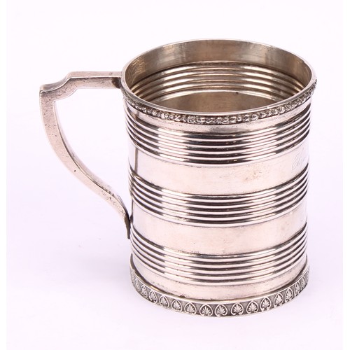 597 - A Chinese China Trade period silver mug, applied rim above three reeded bands, angular scroll handle... 