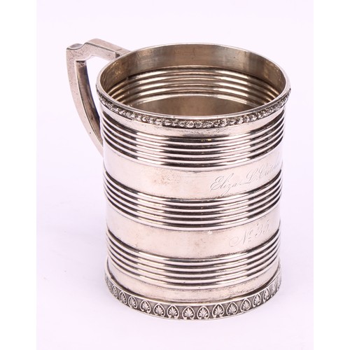 597 - A Chinese China Trade period silver mug, applied rim above three reeded bands, angular scroll handle... 