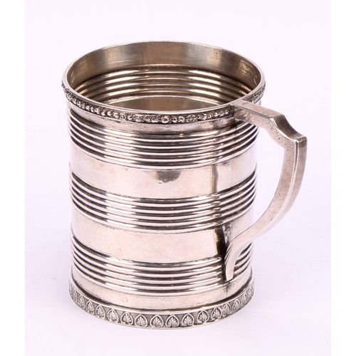 597 - A Chinese China Trade period silver mug, applied rim above three reeded bands, angular scroll handle... 