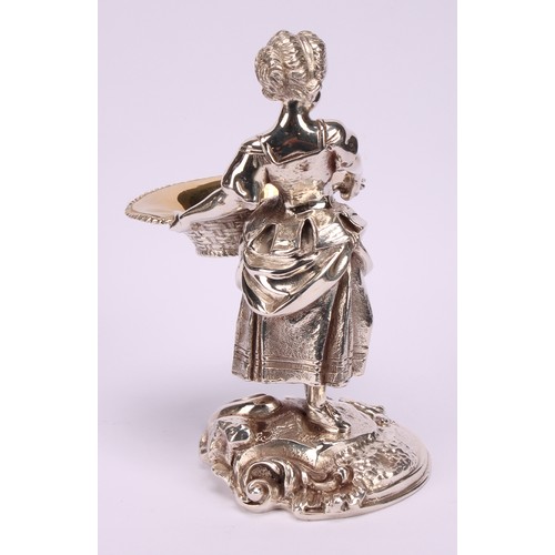 550 - A pair of electroplated sculptural novelty salts, cast as a boy and girl holding baskets, 15cm high