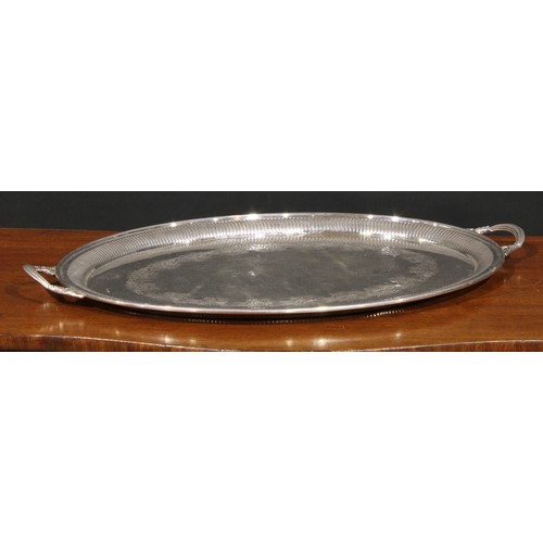 567 - A Victorian EPNS oval two-handled serving tray, fluted border, the field bright-cut engraved with a ... 