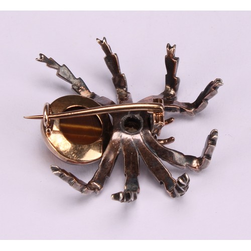 956 - A white and yellow gold coloured metal novelty brooch, as a spider, set with diamonds, rubies, a spl... 