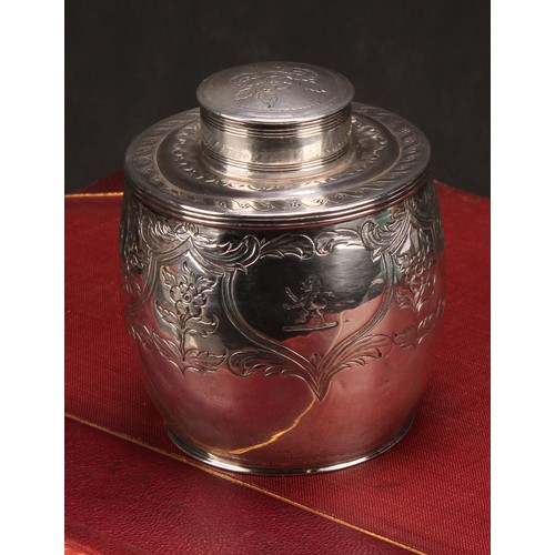 629 - A George III ovoid tea caddy, chased and engraved with foliate scrolls, lion rampant crest, push on ... 