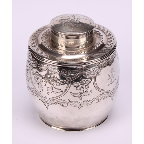 629 - A George III ovoid tea caddy, chased and engraved with foliate scrolls, lion rampant crest, push on ... 