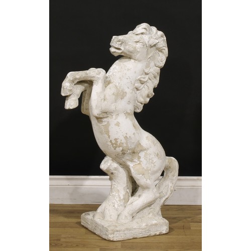 1469 - A reconstituted stone garden statue or gate post pier cap, as a rearing horse, 82cm high, the base 2... 