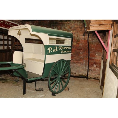 1478 - A late 19th/early 20th century grocer's cart, green and cream livery inscribed P J Dunn.s, Bakers, D... 