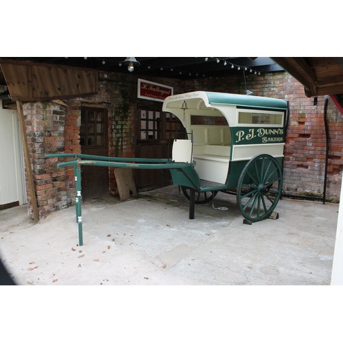 1478 - A late 19th/early 20th century grocer's cart, green and cream livery inscribed P J Dunn.s, Bakers, D... 