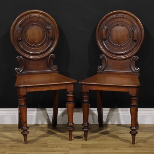 1342 - A pair of Victorian mahogany hall chairs, 88cm high, 44cm wide, 36cm deep, c.1860