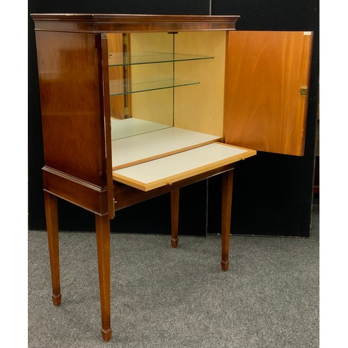 109 - A mahogany cocktail cabinet by Glenister, of High Wycombe, in George III style, with moulded cornice... 