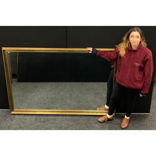 122 - A very large ‘gilt’ frame wall mirror, bevelled glass, 120cm x 180cm;  another, smaller wall mirror,... 