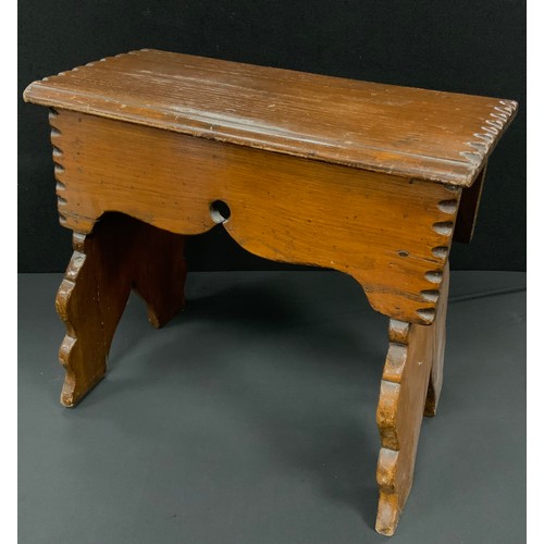 185 - An Arts & Crafts Vernacular boarded oak stool, in the 17th century style, shaped frieze and spreadin... 