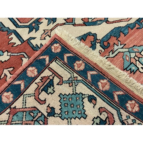 208 - A large middle-eastern Kilim type rug, with cross-chain stitch, geometric floral medallion within tr... 