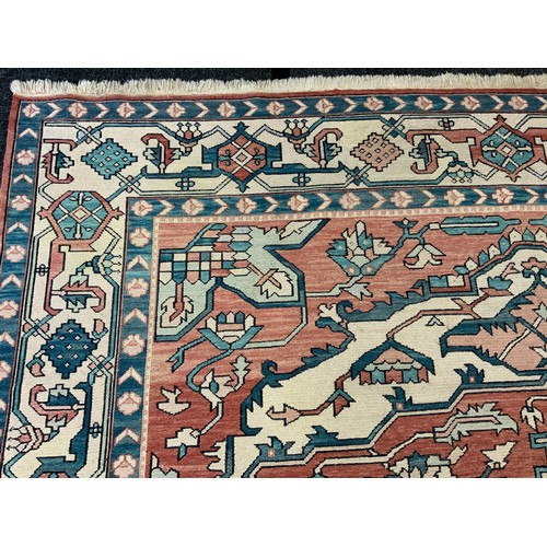 208 - A large middle-eastern Kilim type rug, with cross-chain stitch, geometric floral medallion within tr... 