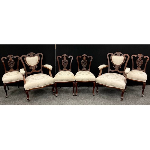 213 - A Victorian mahogany Salon suite, comprising a pair of armchairs, and set of four matching side chai... 