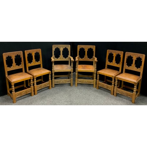 228 - An early to mid 20th century carved oak gothic revival dining suite, possibly early Titchmarsh and G... 