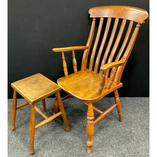 229 - A 19th century lathe-back armchair, 106cm high x 59cm wide;  a 19th century stool, 46cm high, (2).