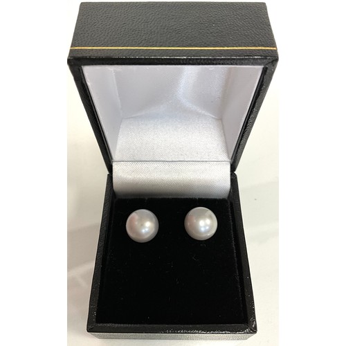 296 - A Pair of 9ct yellow gold studs set with spheroid grey cultured pearls, boxed