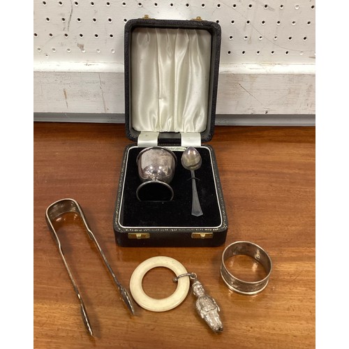 268 - A silver two piece christening set cased;  pair of Scottish silver sugar tongs, Edinburgh 1893;  nap... 