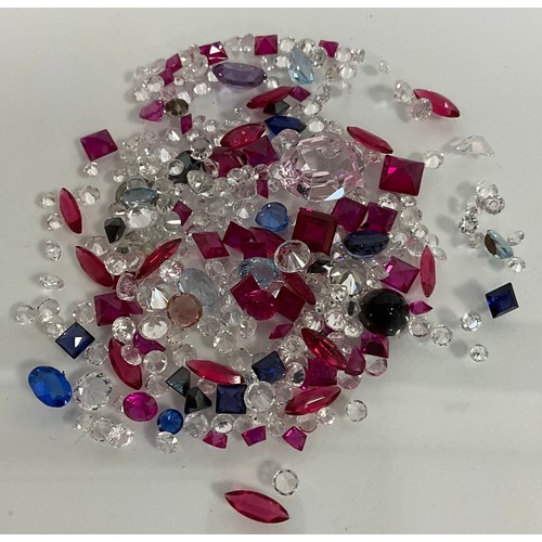 307 - Parcel of loose, mixed-cut red, blue, light blue, white and black stones. total 74.0ct approx