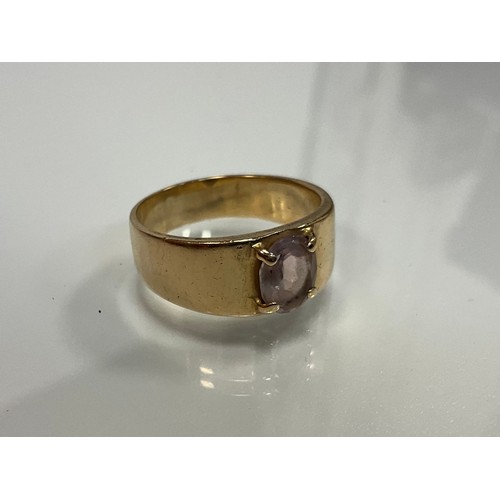 309 - A 9ct gold oval pink stone solitaire ring, London 1968, size R, 5.8g gross