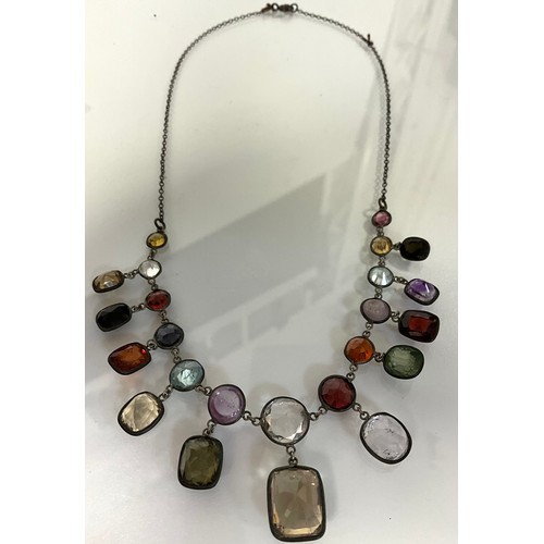 314 - A Vari-gem chandelier necklace, with garnet, citrine, amethyst, quartz, peridot etc, white metal mou... 