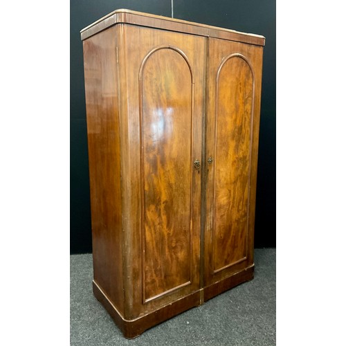 142A - A Victorian mahogany double compactum wardrobe, 187cm high x 117cm wide x 56cm deep.